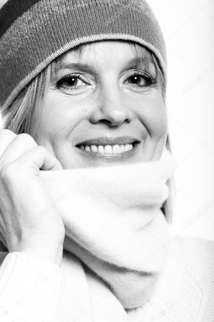 Portrait of good looking mid aged woman over a white background