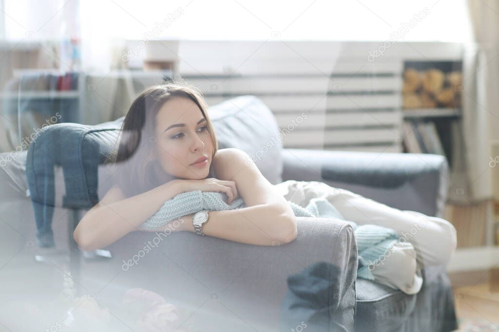 Beautiful young woman at home during the day