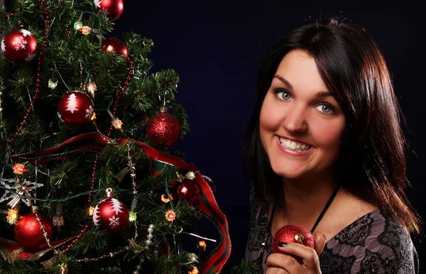 Happy Woman Decorating Christmas Tree Different Balls Stock Image