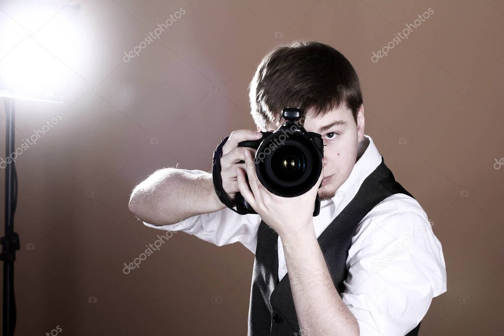 Photographer with camera in studio