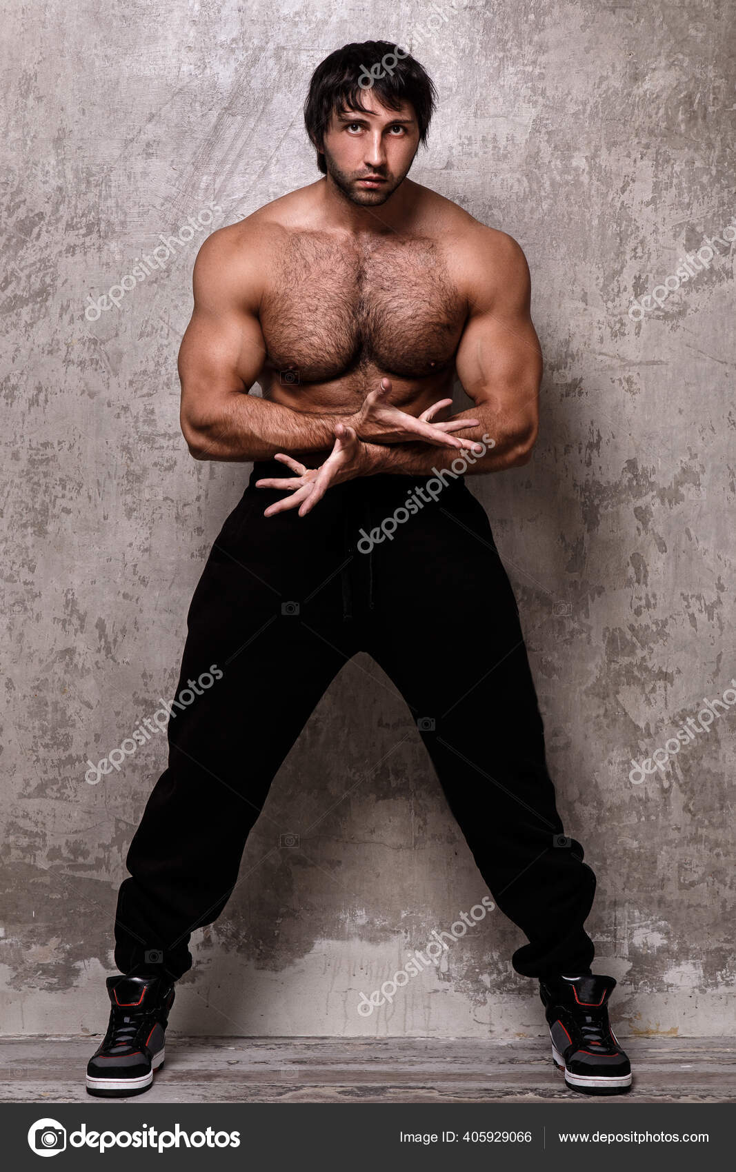 Bodybuilder Man Hairy Chest Stock Photo by racool studio 405929066