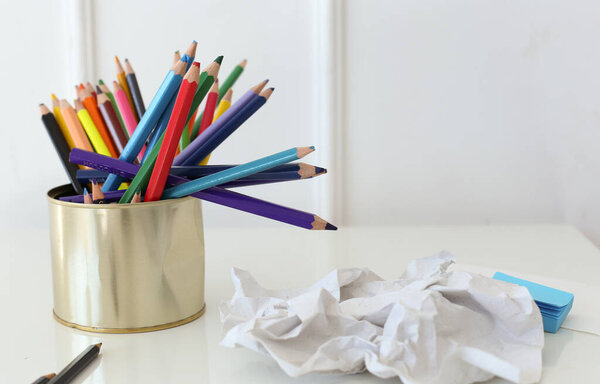 Crumpled sheed of paper on the table