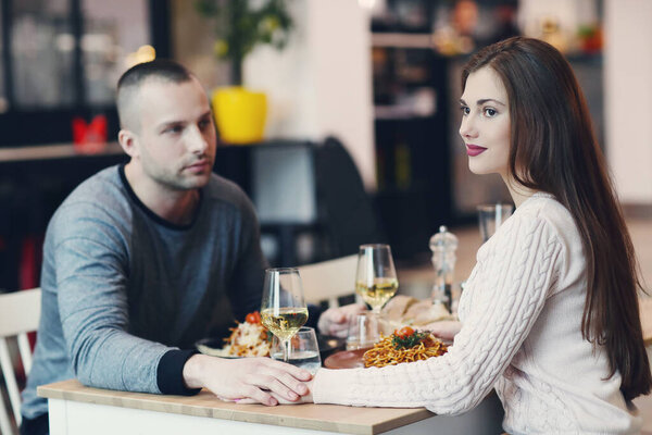 Beautiful lovely couple have a dinner in the restaurant