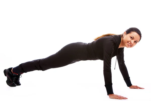 Genç Bir Kadın Beyaz Zemin Üzerine Izole Fitness Egzersizleri Yapıyor — Stok fotoğraf