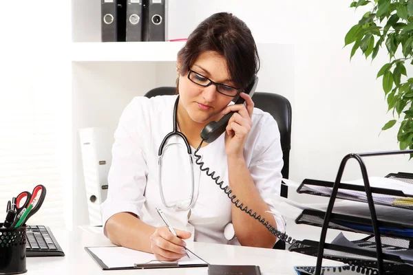 Young Woman Doctor Talking Phone Her Office Royalty Free Stock Images