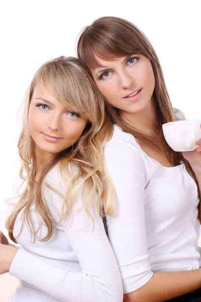 Dos Chicas Alegres Beben Café Aislado Sobre Fondo Blanco —  Fotos de Stock