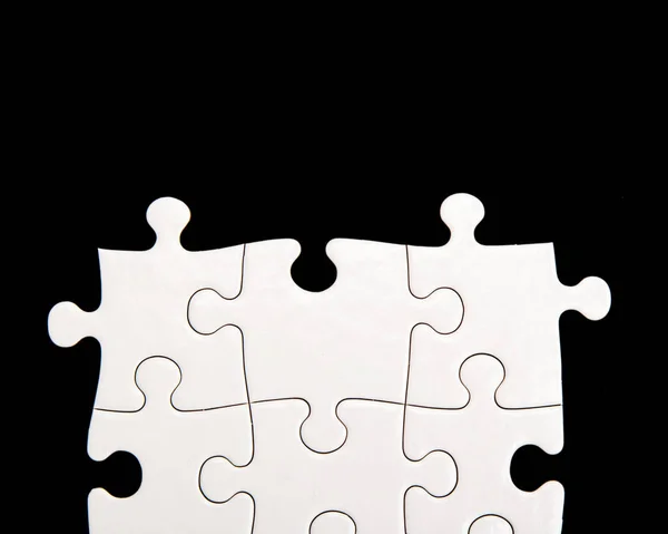 Fehér Puzzle Egy Fekete Háttér — Stock Fotó