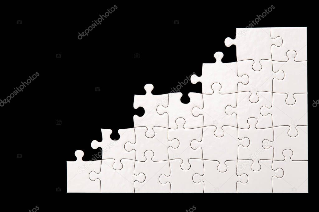 White puzzle on a black background