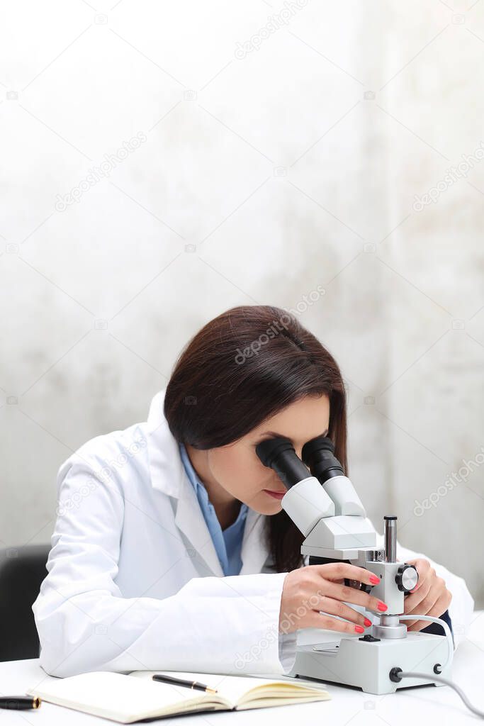 Professional, doctor. Scientist with microscope