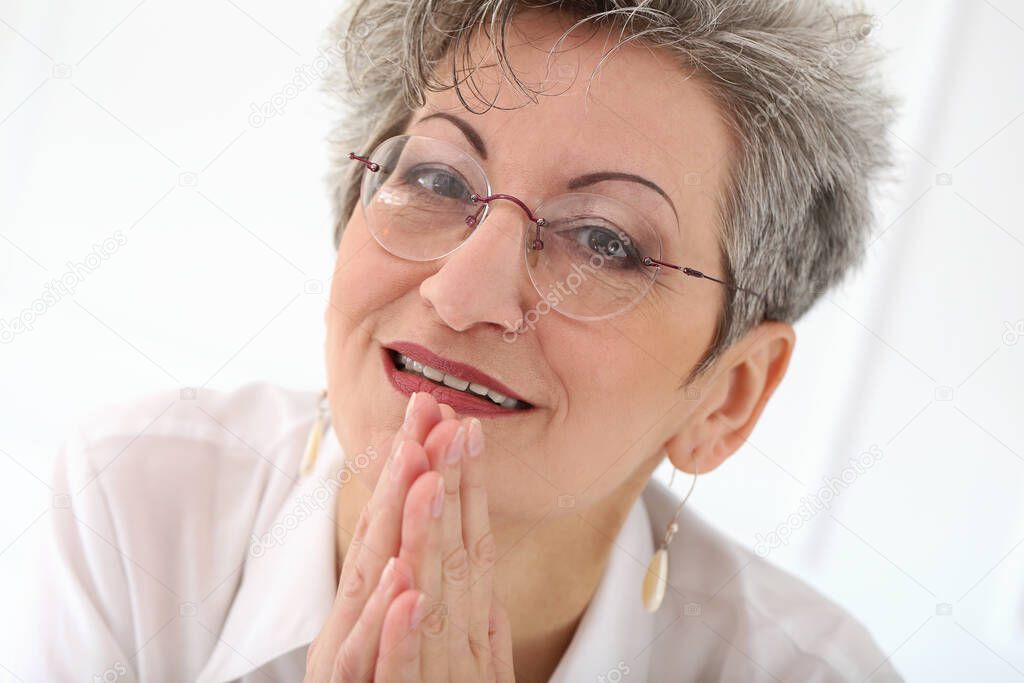 Cute, elderly woman with happy face