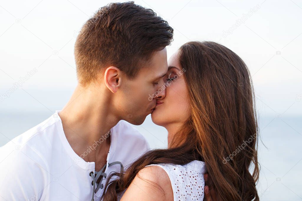 Summer, sea. Cute, lovely couple on the beach