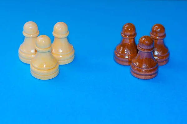 Black and white chess pieces on a blue background. Stop racism. Black lives matter