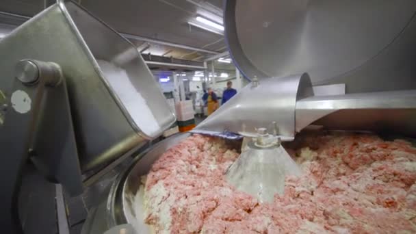 Processing of meat in the food industry on a cutter — Stock Video