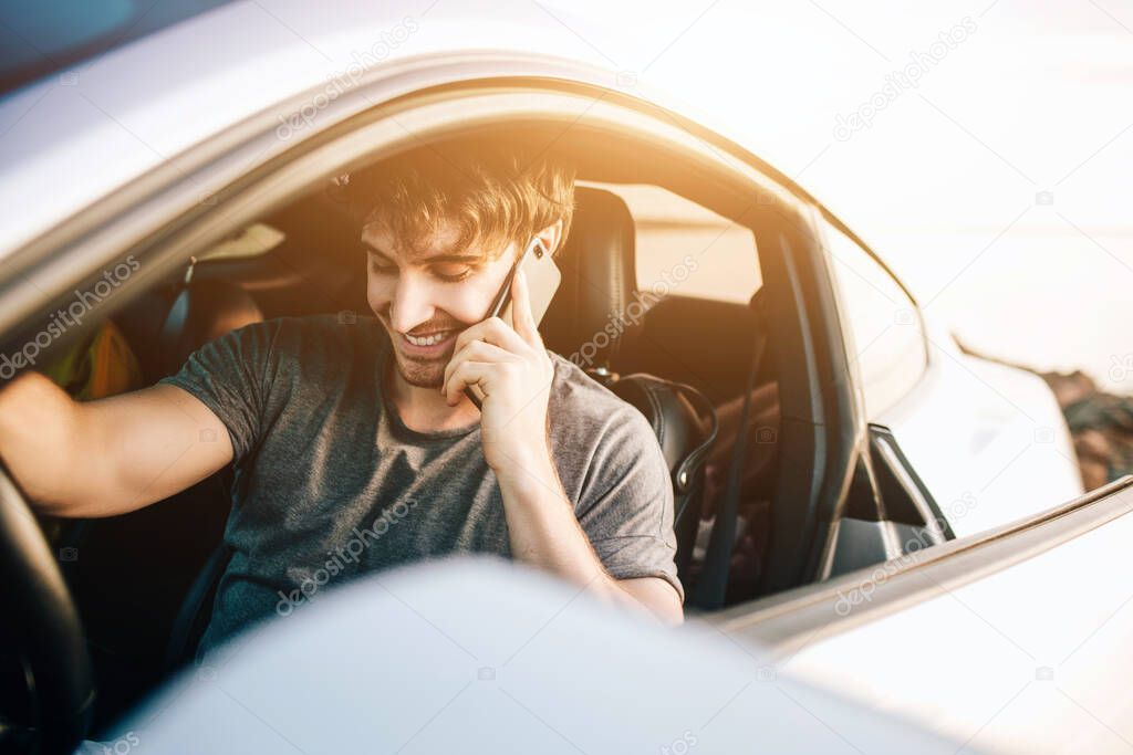 Trendy young men traveling by car. Relaxed happy man on summer roadtrip travel vacation