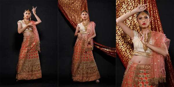 インドの美しさの顔は完璧な結婚式の花嫁を構成します 重いジュエリーと化粧とレッドピンクの伝統的なインドのブライダル衣装で美しい女性の肖像画 — ストック写真