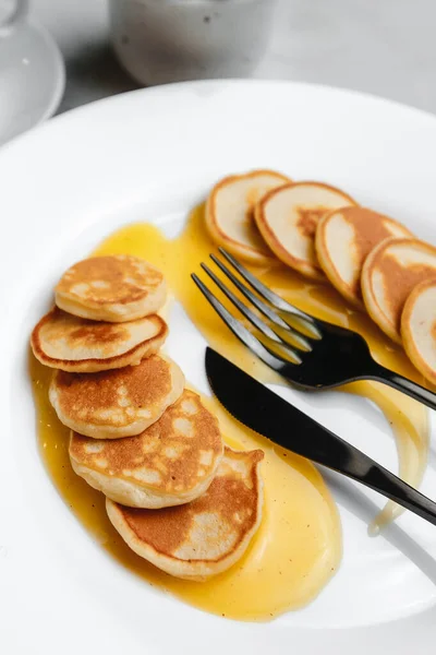 Trendy Homemade Breakfast Mini Pancakes Orange Sauce White Table View — Stock Photo, Image