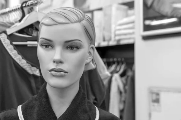 Vintage female mannequin in a clothing store.