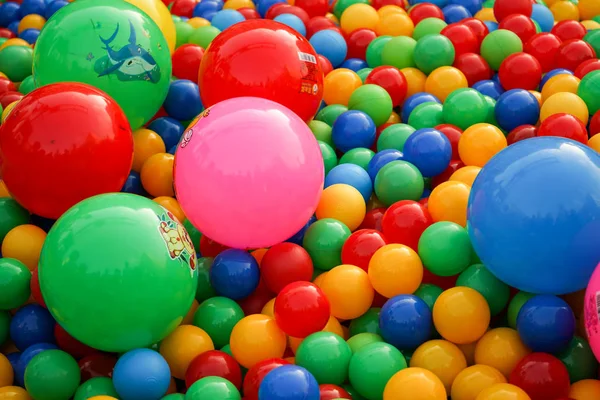 Small balls of different colors on the Playground. — Stock Photo, Image