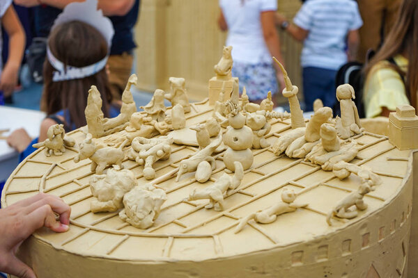 Children's plasticine figurines at the master class on modeling of plasticine.