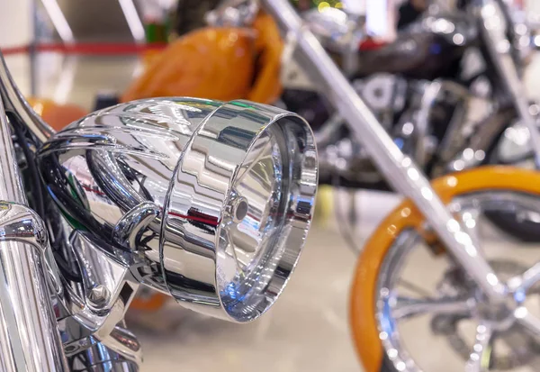Chrome headlight on a modern sports bike.