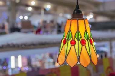 Colored stained glass lamp in the interior. clipart