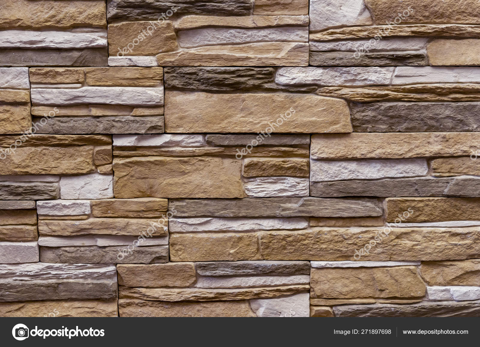 Texture of the stone wall. Panel of stones for finishing the facade of