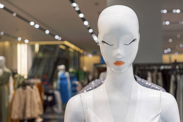 White female mannequin with summer clothes. Female dummy.