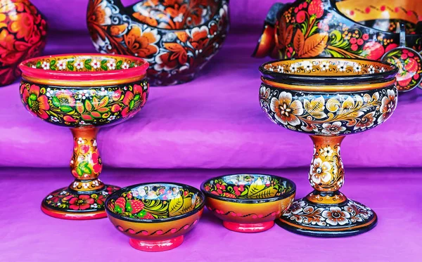 Khokhloma - Old Russian folk painting on wood. Wooden dishes with the national Russian ornament - Khokhloma.