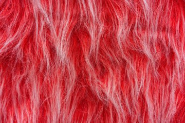 Kırmızı yapay kürk dokusu. Tasarım ve dekorasyon için kürk arka plan.