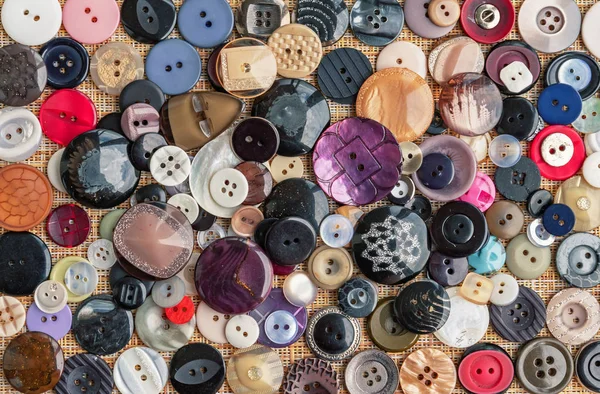 Background of buttons for clothes. Buttons of different shapes and sizes.