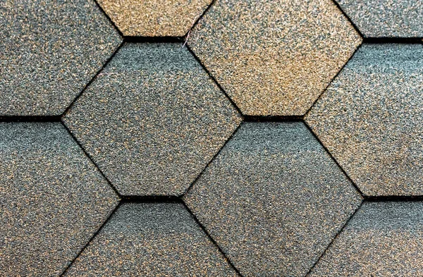 Texture of flexible tiles for the roof flooring of the house. Flexible, soft, bituminous composite materials.