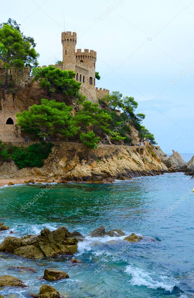 Beautiful view of castle on cliff near beach in Lloret de Mar, Costa Brava, Catalonia, Spain