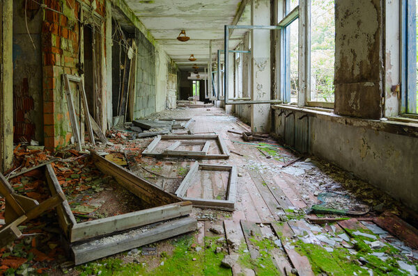 Corridor of abandoned school in resettled village of Pogonnoe in exclusion zone of Chernobyl nuclear power plant, Khoiniki district, Belarus