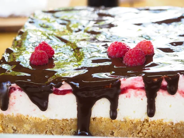 the pastry chef decorates the cake with melted chocolate. chocolate. cook.