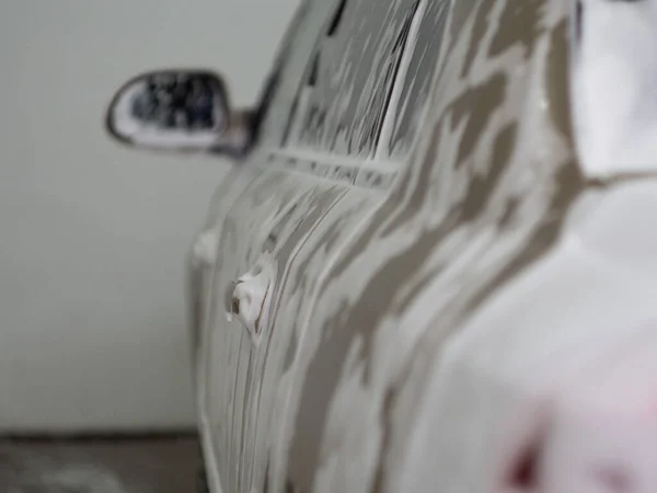 machine in the foam from car shampoo. self-service car wash. dripping foam.