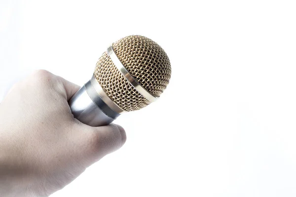 Mužská Ruka Drží Mikrofon Bílém Pozadí Hrotem Pozlacené — Stock fotografie