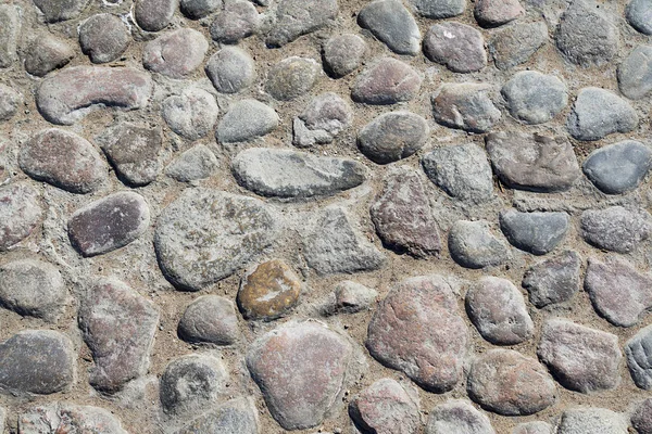 Graue Kopfsteinpflasterbeschaffenheit Des Bodens Mit Vielen Steinen Als Hintergrund Oder — Stockfoto