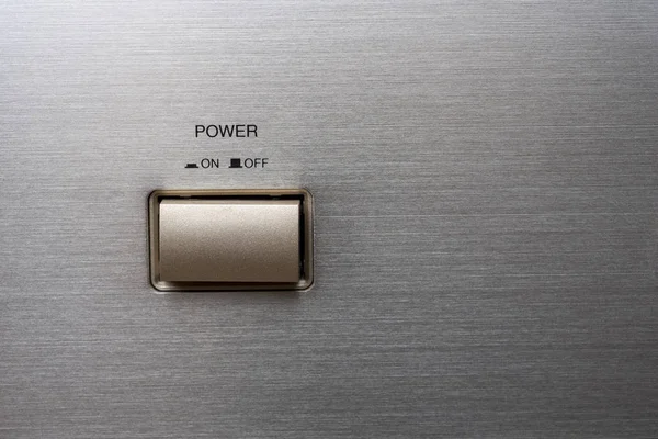 Metal power button on metal case. like background.