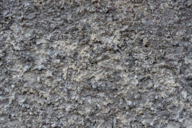 Bir sıra dışı taş kabartma duvar doku çıkıntı dekoratif sıva ile gri boya ile boyanmıştır. Duvar dokusu.