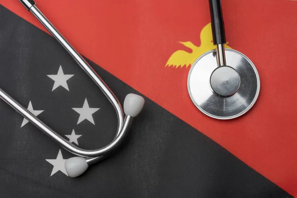Флаг Папуа Новой Гвинеи Стетоскоп Концепция Медицины Стетоскоп Фоне Флага — стоковое фото