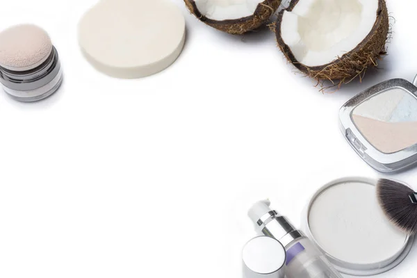 Natural herbal skin care products, top ingredients, coconut, isolated background makeup brushes for face and cosmetic products. Preparation facial skin care.