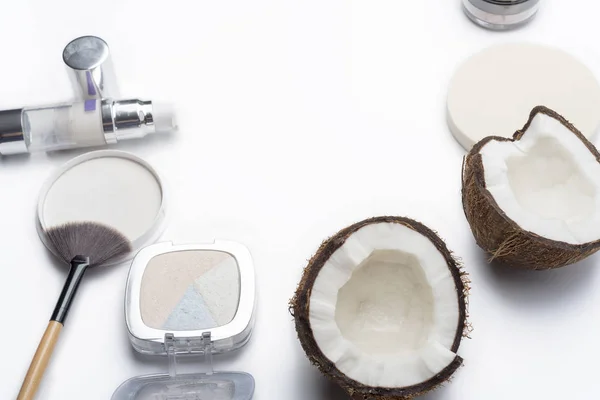 Natural herbal skin care products, top ingredients, coconut, isolated background makeup brushes for face and cosmetic products. Preparation facial skin care.