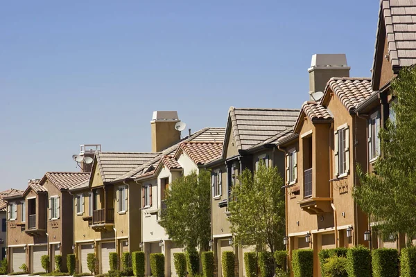 Variation of color homes in a row.