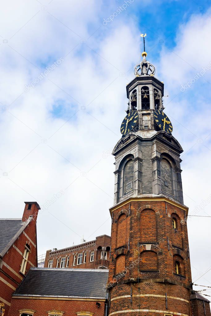 Dutch Renaissance Architecture of a tall European Clock Tower in Holland, Amsterdam. 