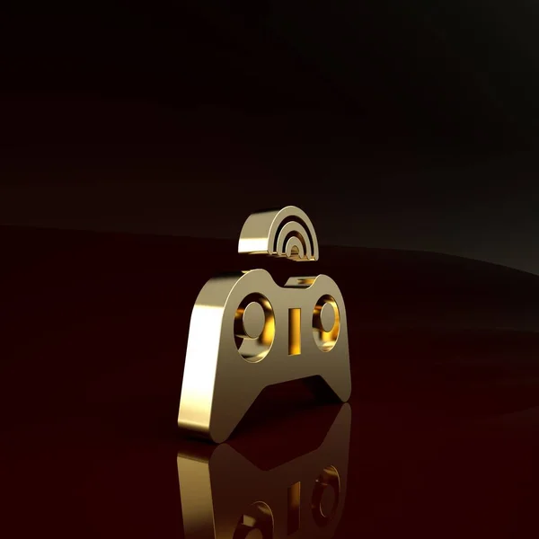 Ícone de gamepad sem fio dourado isolado no fundo marrom. Controlador de jogo. Conceito de minimalismo. 3D ilustração 3D render — Fotografia de Stock