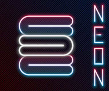 Parlayan neon hattı havlu yığını simgesi siyah arkaplanda izole edildi. Renkli taslak konsepti. Vektör İllüstrasyonu.
