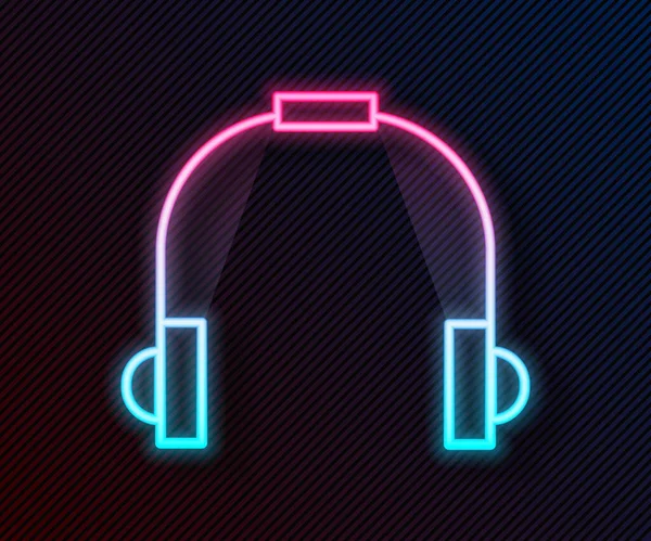 Parlayan neon hattı kulaklık simgesi siyah arkaplanda izole edildi. Kulaklıklar. Müzik, hizmet, iletişim ve operatör konsepti. Vektör İllüstrasyonu.