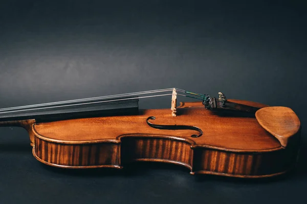 beautiful violin musical instrument on black background