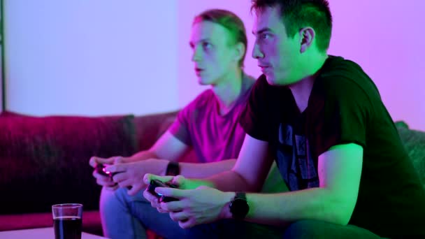 Two Happy Friends Playing Action Video Game Living Room Sitting — 图库视频影像
