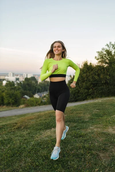 Healthy fitness woman jogging outdoors. Athletic women